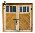 Vintage yellow wooden garage doors with glass windows Royalty Free Stock Photo