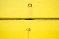 Vintage yellow wooden panels with rusty nails Royalty Free Stock Photo