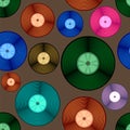 Vinyl colored plate disc isolated on brown background. Music retro seamless pattern Royalty Free Stock Photo