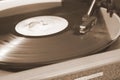 Vinyl disc played on old retro vintage device Royalty Free Stock Photo