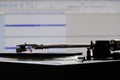 Vinyl player cartridge and tonearm during analog to digital audio conversion Royalty Free Stock Photo