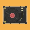 Vinyl player with a vinyl disk. Modern gramophone player with black musical vinyl on the orange background