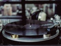 Vinyl record being played on a turntable deck