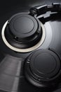 Vinyl record with black headphones close-up Royalty Free Stock Photo