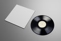 Vinyl record with blank cover on gray background. Mock up template Royalty Free Stock Photo