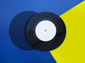 Vinyl record on blue and yellow background photo collage Royalty Free Stock Photo