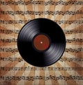 Vinyl record on the music note paper