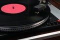 Vinyl record in an old turntable, close-up view Royalty Free Stock Photo