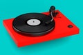 Vinyl record player or DJ turntable with retro vinyl disk on green background. Royalty Free Stock Photo