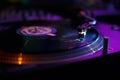 Vinyl record player needle in close up. DJ turntable plays music on hip hop party in night club Royalty Free Stock Photo