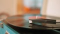 Vinyl record player with the needle on the rotating plate. Action. Close up of working retro vinyl player on home Royalty Free Stock Photo