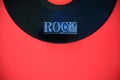 Vinyl record with rock word on red background