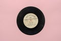 Vinyl record from the `70s. Black gramophone record against pink Royalty Free Stock Photo