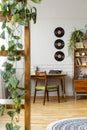 Vinyls above desk with typewriter in stylish vintage apartment