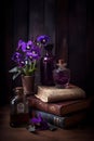viola flowers with ancient books