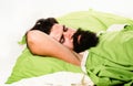 Violations of sleep and wakefulness. Young man sleeping on soft pillows in bed at home. Man bearded hipster having Royalty Free Stock Photo