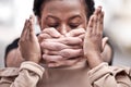 Violence against women is out of hand. a young woman being silenced during a protest. Royalty Free Stock Photo