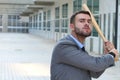 Violent looking male holding baseball bat