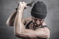 Violent man using a spanner as a weapon