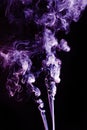 Violet abstract shaped smoke against black background. Abstract background Royalty Free Stock Photo