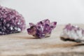 Violet amethyst crystal on wooden background. Copy, empty space for text Royalty Free Stock Photo