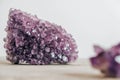 Violet amethyst crystal on wooden background. Copy, empty space for text Royalty Free Stock Photo