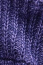 Violet knitted woolen fabric texture. Background. Needlework as background