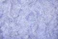 Violet blue background, textured plastered wall, empty for isolates or text.