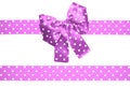 Violet bow and ribbon with white polka dots made from silk Royalty Free Stock Photo