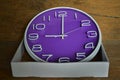 Violet circle clock in white paper box