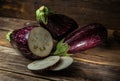 Violet eggplants on rural wooden background Royalty Free Stock Photo