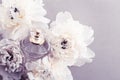 Violet fragrance bottle as luxury perfume product on background of peony flowers, parfum ad and beauty branding