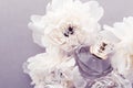 Violet fragrance bottle as luxury perfume product on background of peony flowers, parfum ad and beauty branding