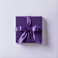 Violet gift box with a purple bow made of satin on soft beige background. St Valentines day, Birthday, New Year, Christmas,