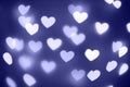 Violet hearts bokeh background. Color of the year 2022 Very Peri. Valentines Day concept. Romantic texture Royalty Free Stock Photo