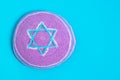 Violet kipa on a blue background, top view. Jewish New Year, Rosh Hashanah