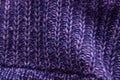 Violet knitted woolen fabric texture. Background. Needlework as background