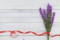 Violet liatris flowers with red ribbon