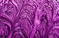 Violet mixed paint abstract background. Purple and gold marble pattern. Royalty Free Stock Photo