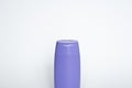 Violet plastic bottle of body care and beauty products. Studio photography of plastic bottle for shampoo, shower gel Royalty Free Stock Photo