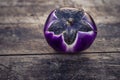 Violet purple Round eggplant, dark food photography, moody background closeup. Selective focus, aubergine Melanzana