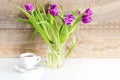 Violet purple tulips colorful bouquet in vase.Beautiful tenderness flowers.Spring floral romantic gift card,coffee Royalty Free Stock Photo