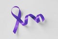 Violet ribbon on white background - Concept of Domestic Violence awareness; Alzheimer`s disease, Pancreatic cancer, Epilepsy Royalty Free Stock Photo