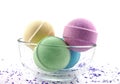 Violet salt and multicoloured bath balls Royalty Free Stock Photo