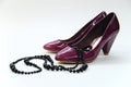 Violet shoes whit necklace Royalty Free Stock Photo