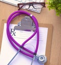 Violet stethoscope on a laptop computer