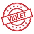 VIOLET text written on red vintage stamp