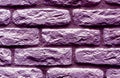 Violet toned brick wall surface.