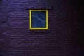 Violet wall background with yellow windows Royalty Free Stock Photo