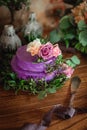 Violet wedding cake in rustic style